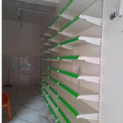 Wall Channel Rack white shelves and green endcap