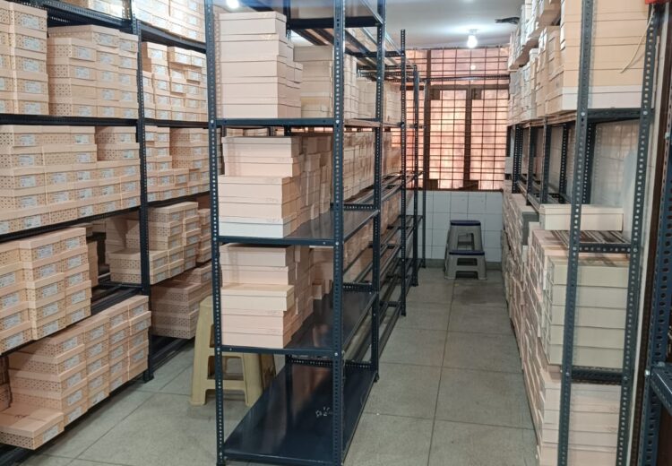 Heavy duty racks and slotted angle racks in Gurgaon, shoe boxes kept on it for easy inventory access and management.