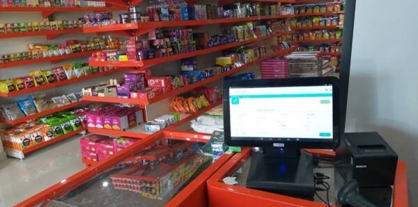 Cash Counter - For every Store, billing counter or cash counter is the underrated item. and Mild Steel Racks, Display Racks in Meerut, Customized Racks for Shop, including a counter in orange and stainless steel and shop is filled with daily use items