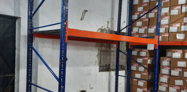 Warehouse Racks in Noida which are blue and orange in colour and have nothing on it with base level