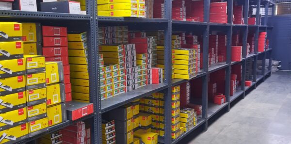 "GKSP Racking", Slotted angle rack Manufacturer in Bahadurgarh- Manufacturing slotted angle racks with GI panels from a decade. This rack has 7 feet height and is in dark grey color and have stored many types of boxes with electrical items/materials inside.