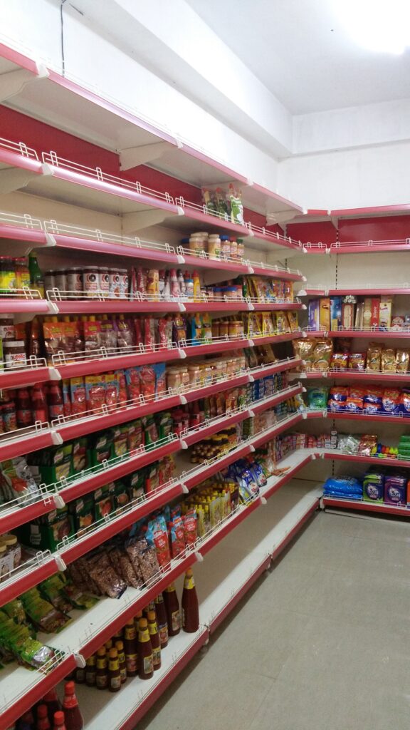 This image provides a closer look at the shelves in the store, revealing an even more extensive selection of products. The shelves are filled with a wide variety of household items, personal care products, and food items. The organization create a visually cohesive and appealing shopping environment.